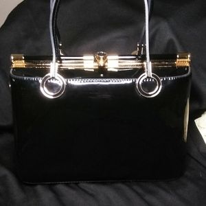 Large Black and gold faux patent leather purse.